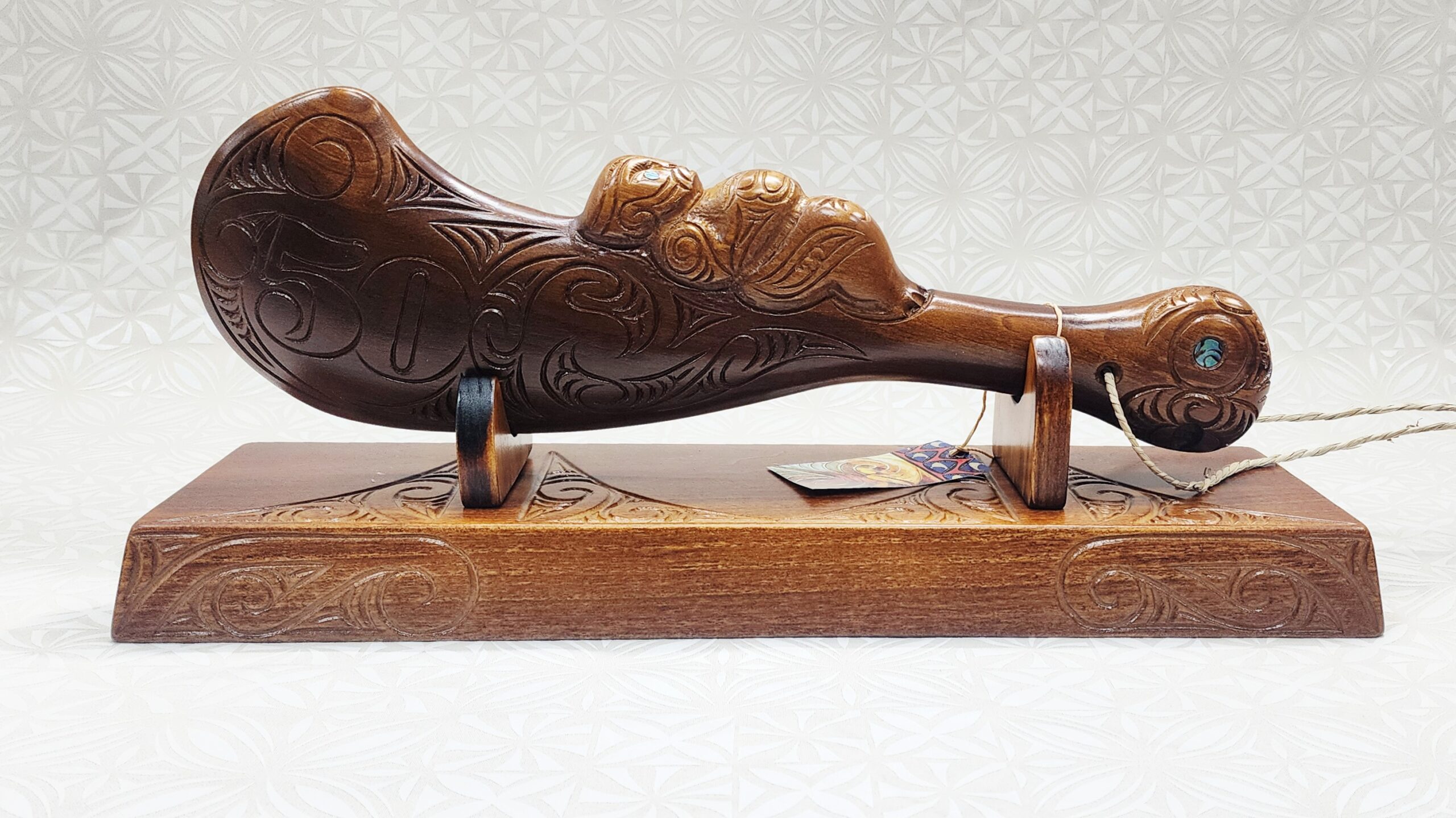 Large Carved Maori Wahaika Club with Carved 50 on Stand 21st Keys 