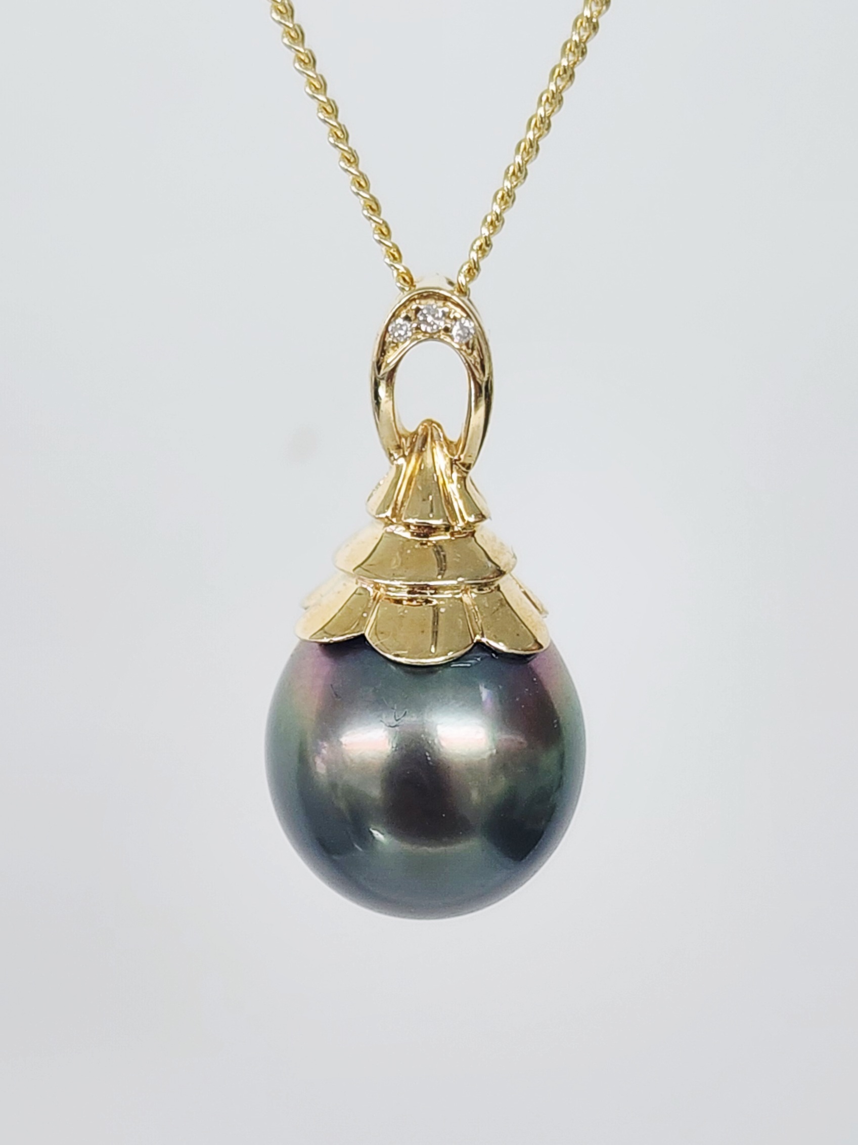 9CT Yellow Gold Tahitian Black Pearl Pendant with Diamond Accents – 11.5mm–12mm - 9CTTLZTBPDIA Seiko 9CT Yellow Gold Tahitian Black Pearl Pendant with Diamond Accents – 11.5mm–12mm - 9CTTLZTBPDIA Seiko