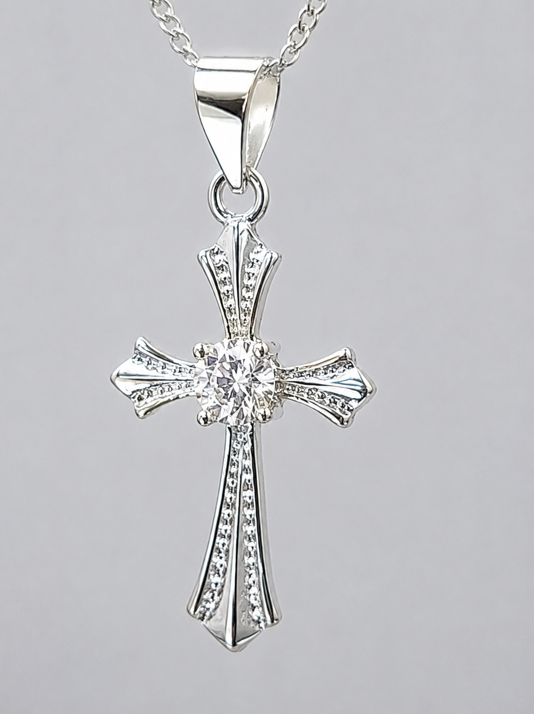 Sterling Silver Cross Pendant with 3.4mm Cubic Zirconia Centre Stone & Complimentary Sterling Silver Chain – 12mm x 20mm - 18006024 Seiko Sterling Silver Cross Pendant with 3.4mm Cubic Zirconia Centre Stone & Complimentary Sterling Silver Chain – 12mm x 20mm - 18006024 Seiko
