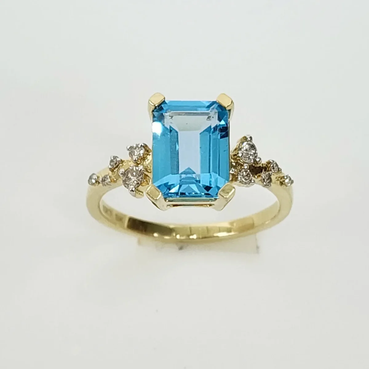 10ct Yellow Gold 0.15ct Diamond & 2.40ct Emerald Cut Blue Topaz Ring - SKR41115BT
