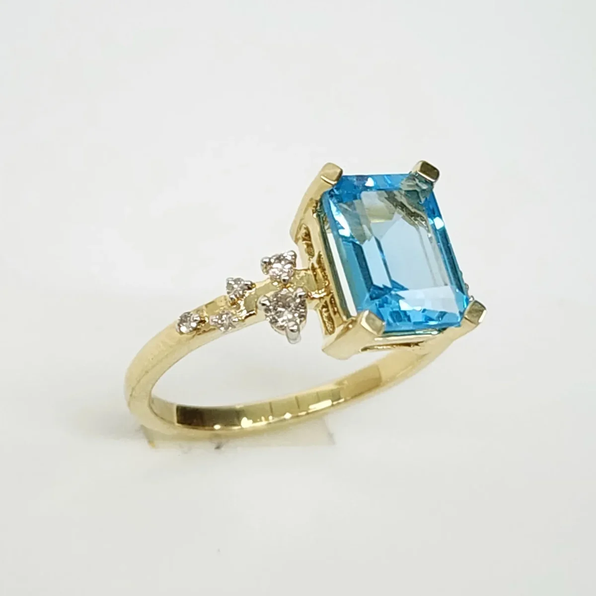10ct Yellow Gold 0.15ct Diamond & 2.40ct Emerald Cut Blue Topaz Ring - SKR41115BT