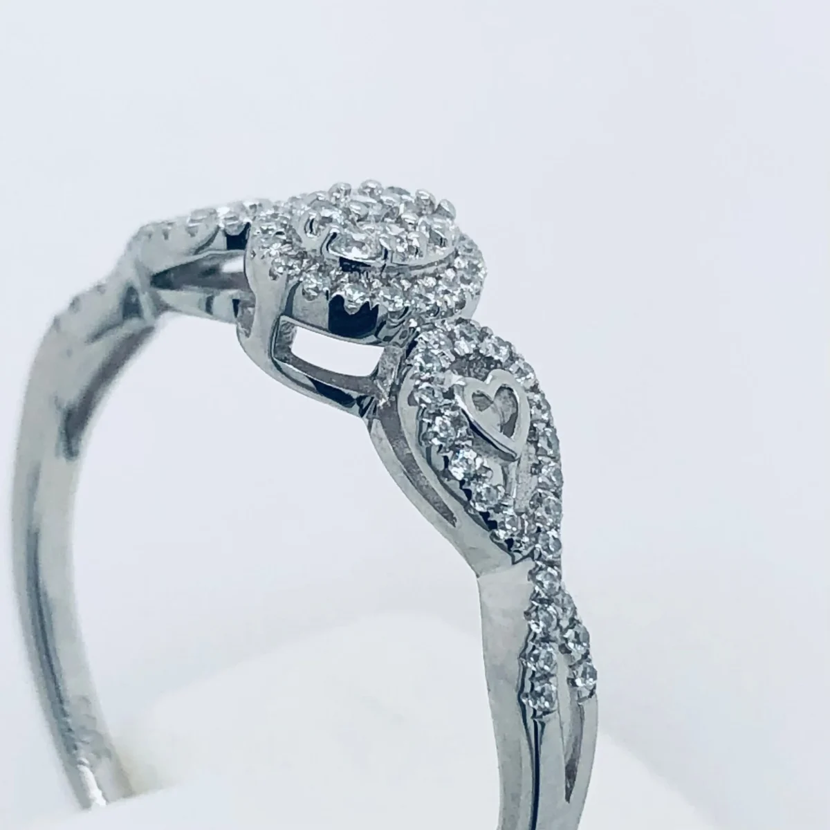Sterling Silver Cluster Ring With Cubic Zirconia Setting and Crossover Band