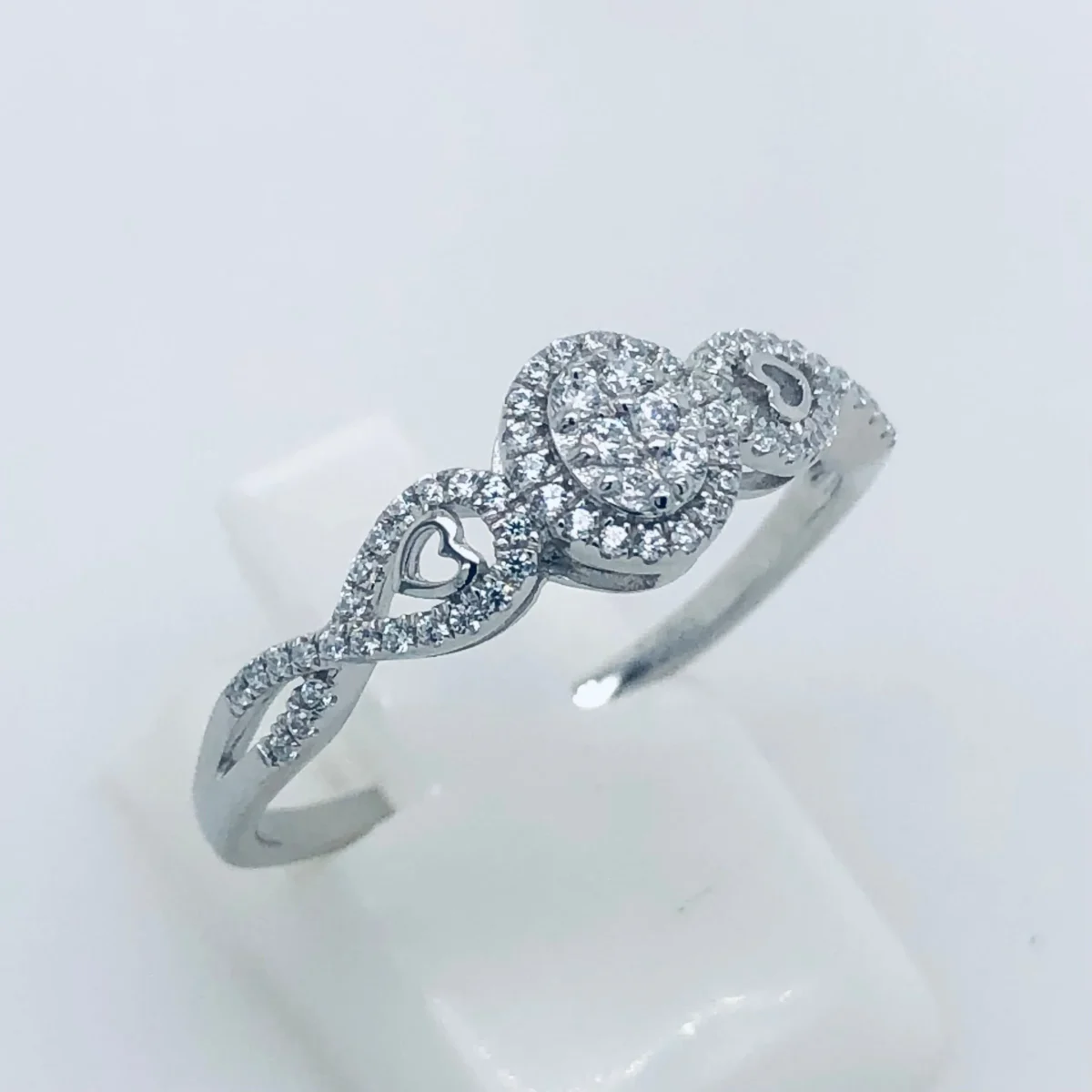 Sterling Silver Cluster Ring With Cubic Zirconia Setting and Crossover Band