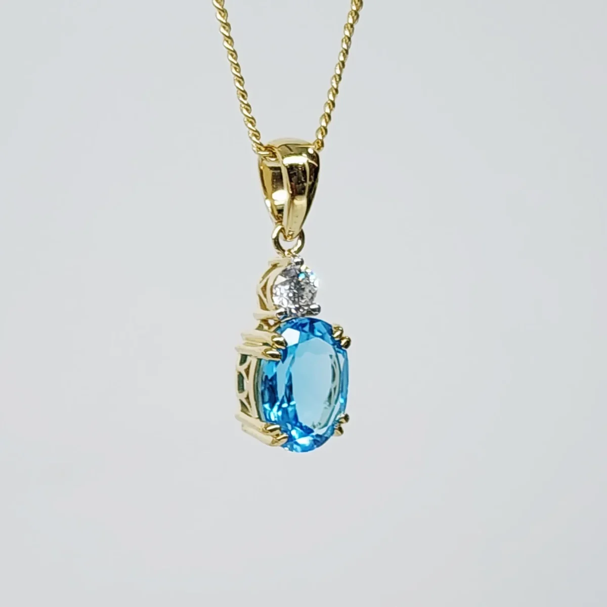 9ct Yellow Gold Oval Cut Blue Topaz and 0.17ct Round Cut Lab Grown Diamond Pendant - D/A470PD-TPZLG