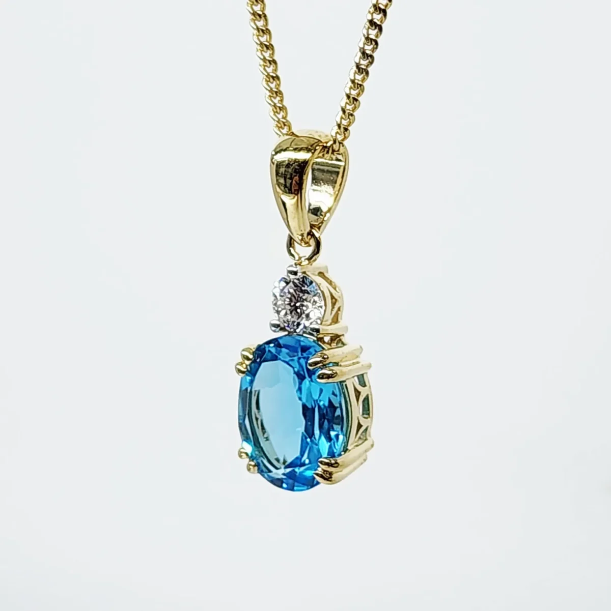 9ct Yellow Gold Oval Cut Blue Topaz and 0.17ct Round Cut Lab Grown Diamond Pendant - D/A470PD-TPZLG