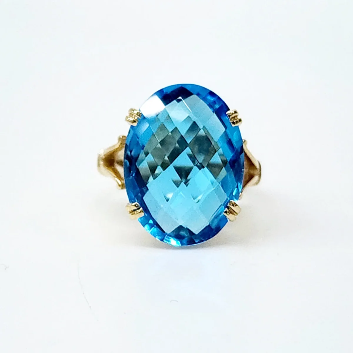 9YG Natural 20mm x 15mm Oval 20ct Blue Topaz with Checkerboard Cut Dress Ring