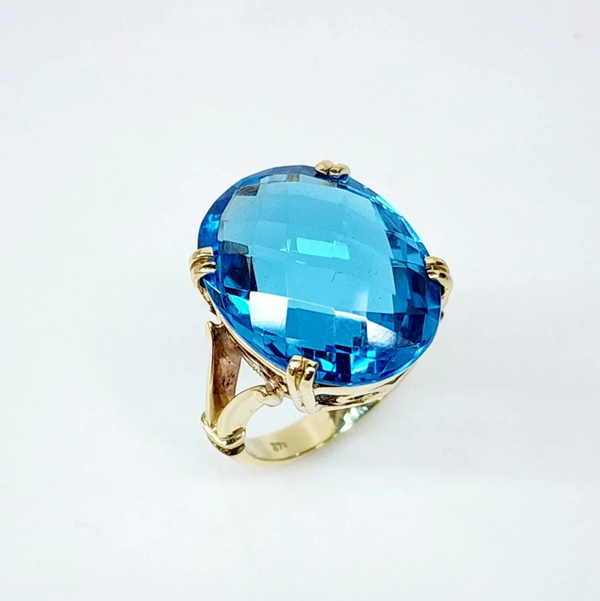 9YG Natural 20mm x 15mm Oval 20ct Blue Topaz with Checkerboard Cut Dress Ring