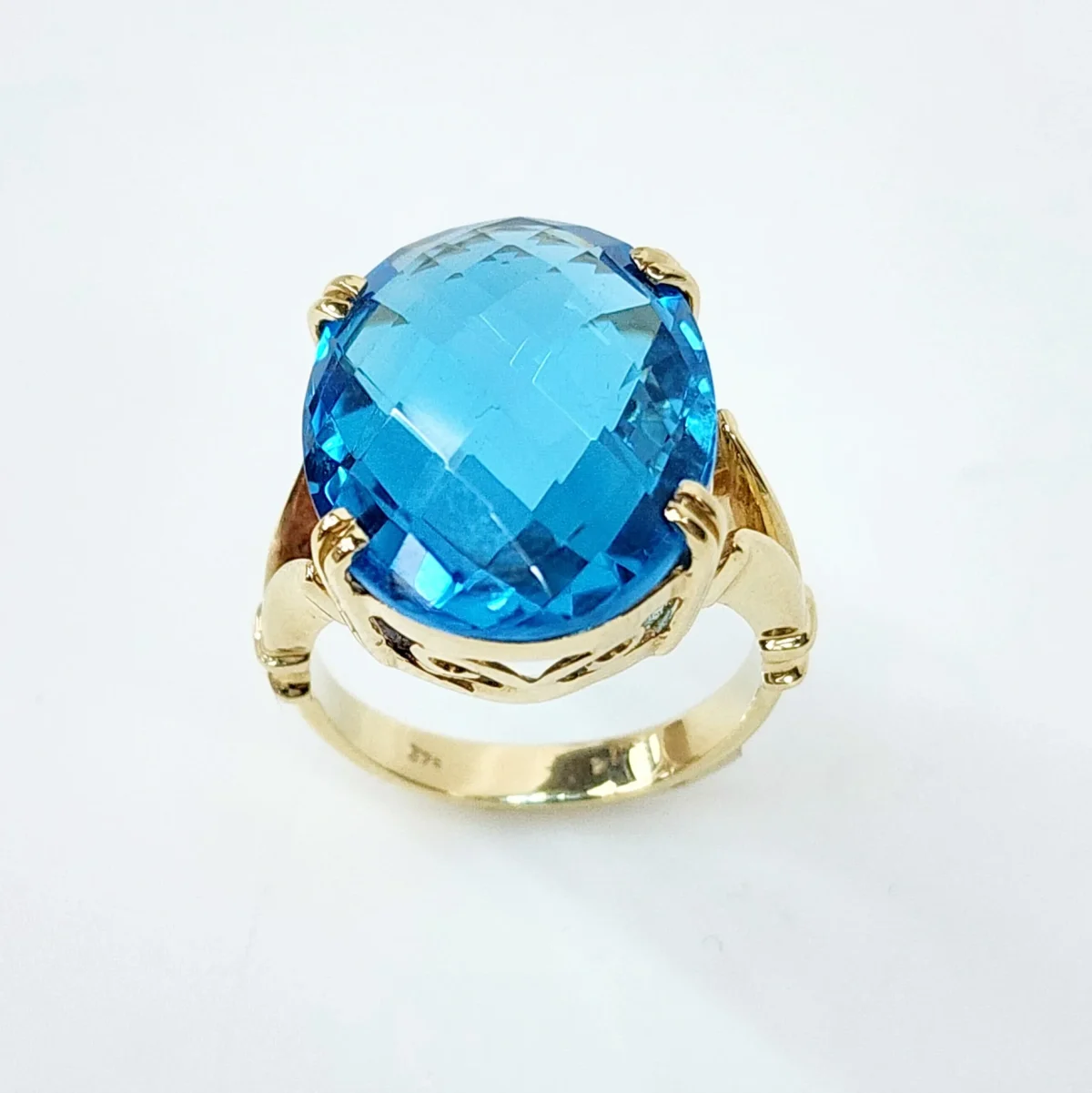 9YG Natural 20mm x 15mm Oval 20ct Blue Topaz with Checkerboard Cut Dress Ring