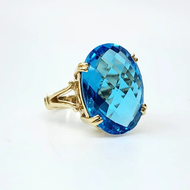 9YG Natural 20mm x 15mm Oval 20ct Blue Topaz with Checkerboard Cut Dress Ring