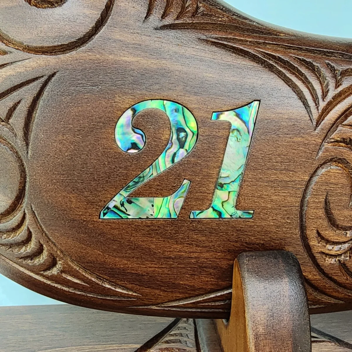Large Carved Maori Wahaika Club with 21 Paua Inlaid on Stand