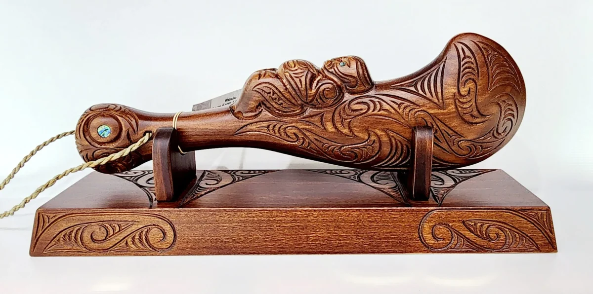 Large Carved Maori Wahaika Club with 21 Paua Inlaid on Stand