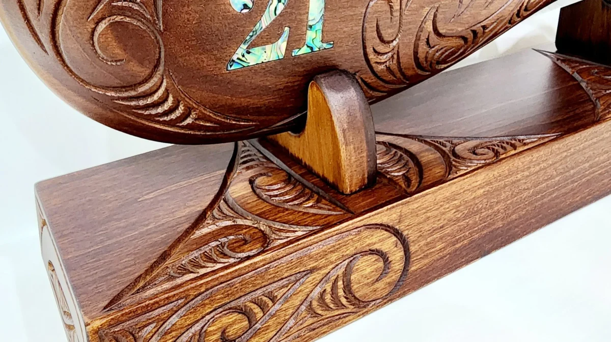 Large Carved Maori Wahaika Club with 21 Paua Inlaid on Stand