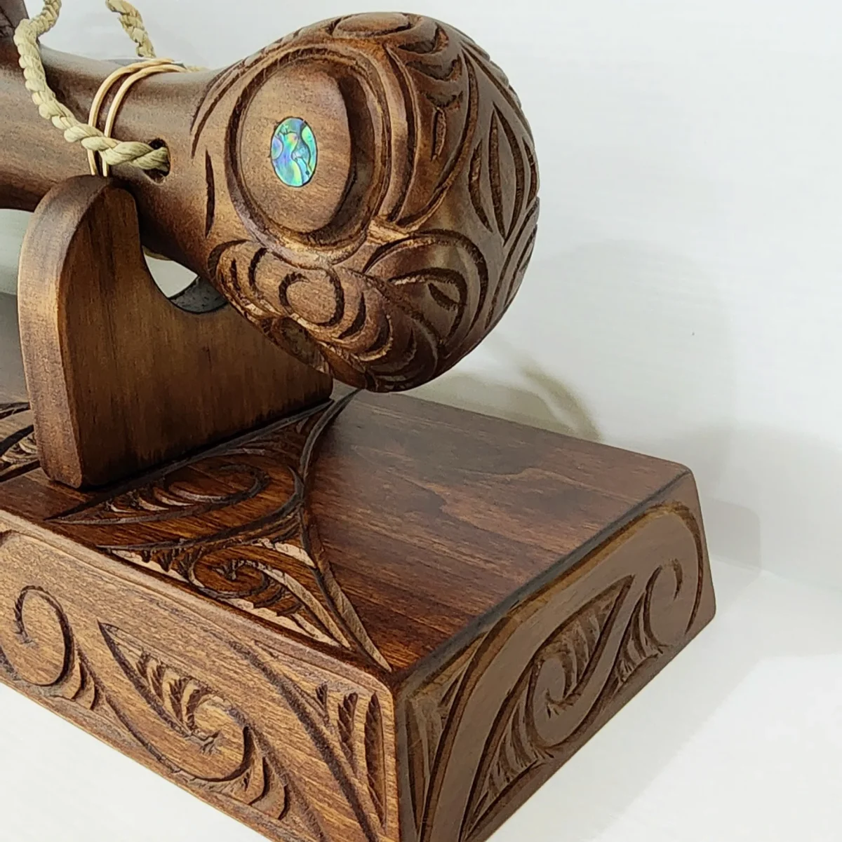 Large Carved Maori Wahaika Club with 21 Paua Inlaid on Stand
