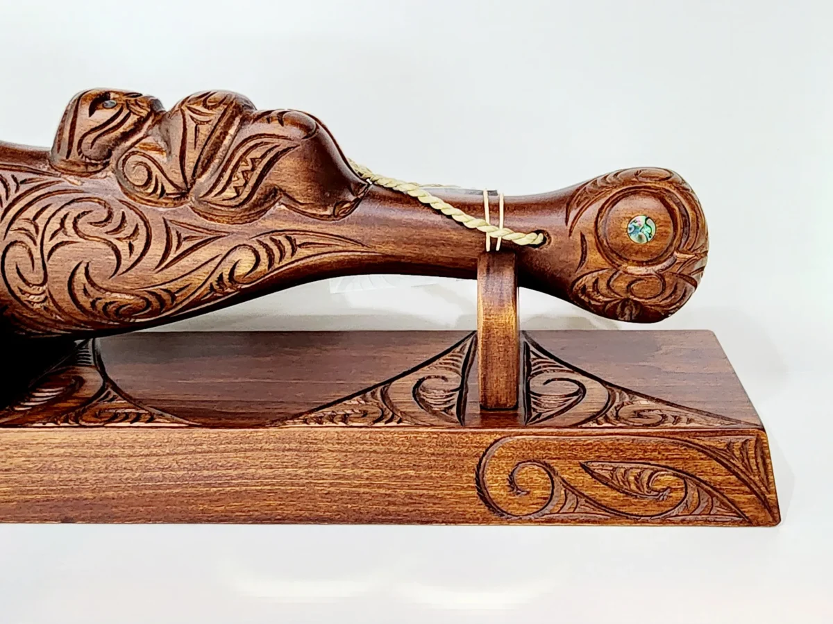 Large Carved Maori Wahaika Club with 21 Paua Inlaid on Stand