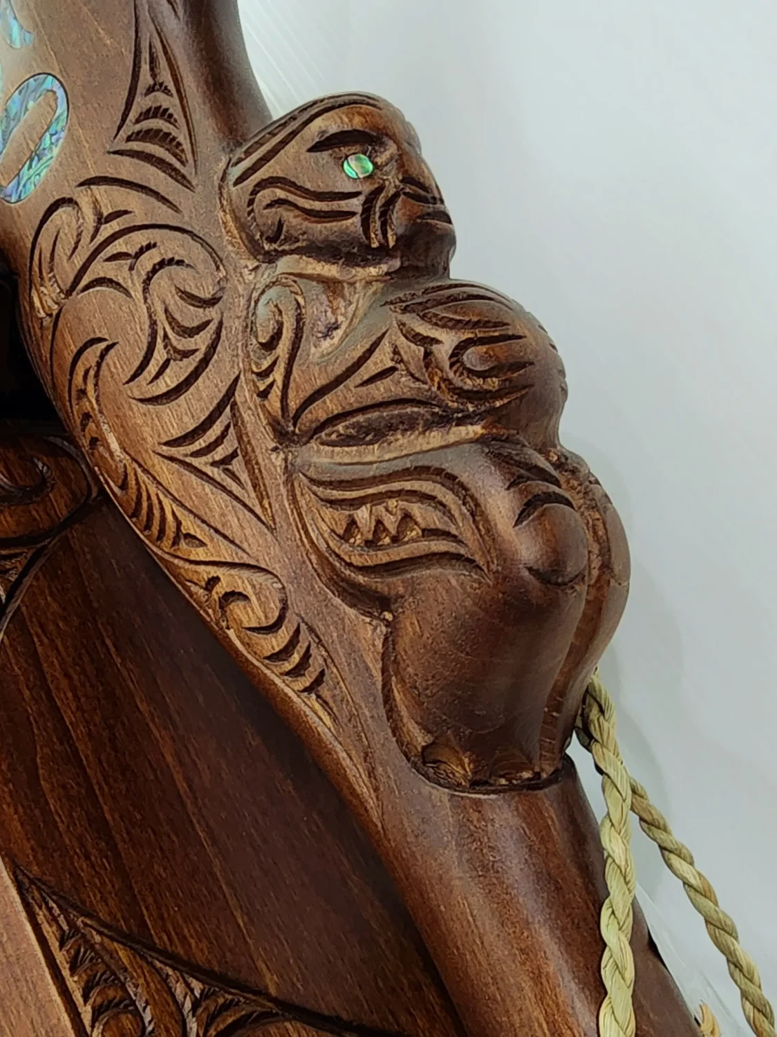 Large Carved Maori Wahaika Club with 50 Paua Inlaid on Stand