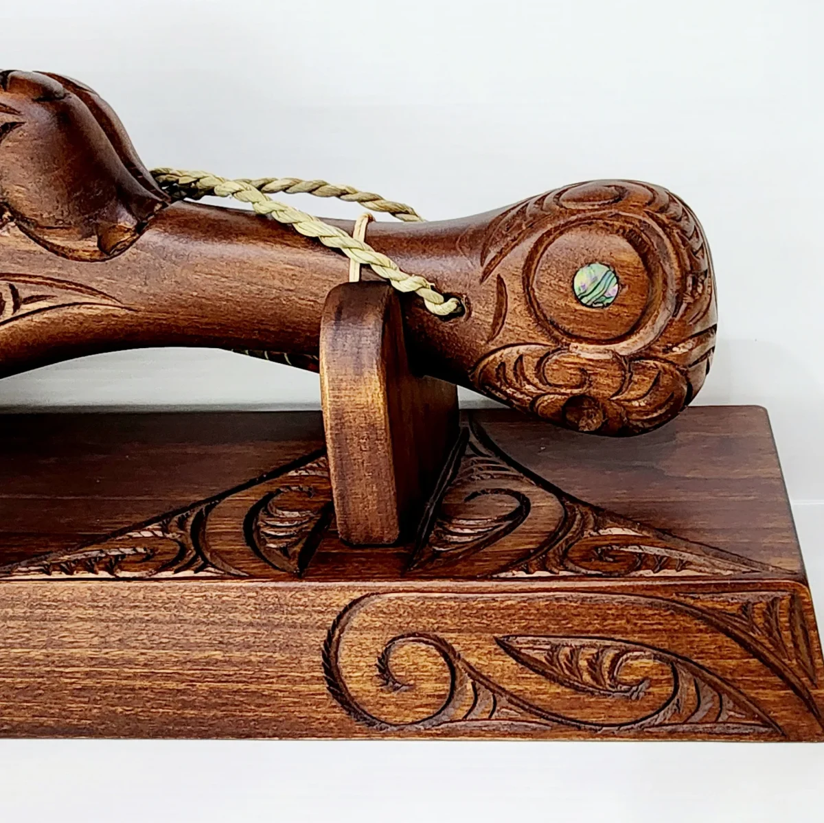Large Carved Maori Wahaika Club with 50 Paua Inlaid on Stand