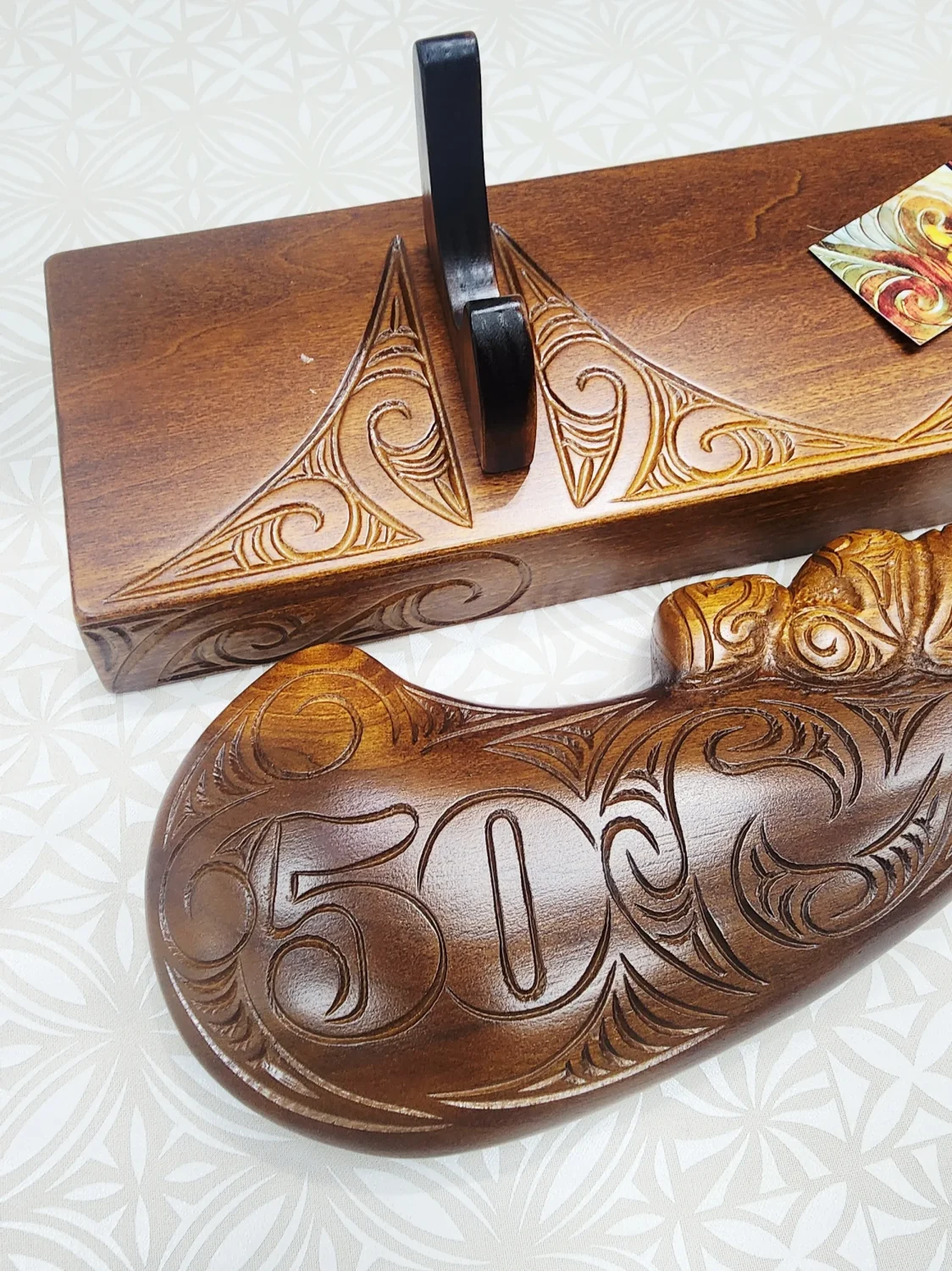Large Carved Maori Wahaika Club with Carved 50 on Stand