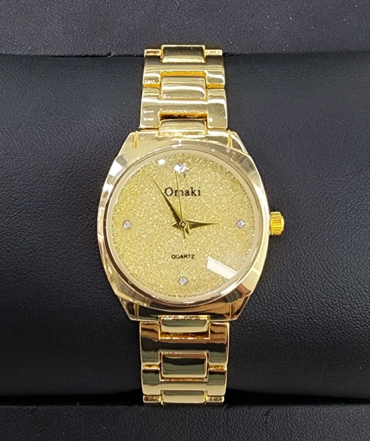 OMAKI Womens Gold Tone Dress Watch with Gold Glitter Face