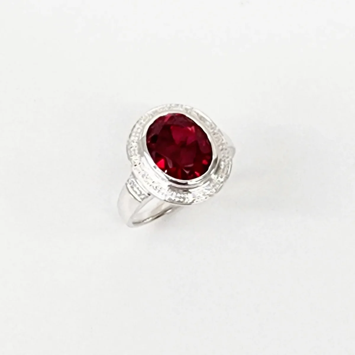 Sterling Silver 10mm x 13mm Ocal Cut Bezel Set Red CZ and Halo CZ Setting Ladies Dress Ring