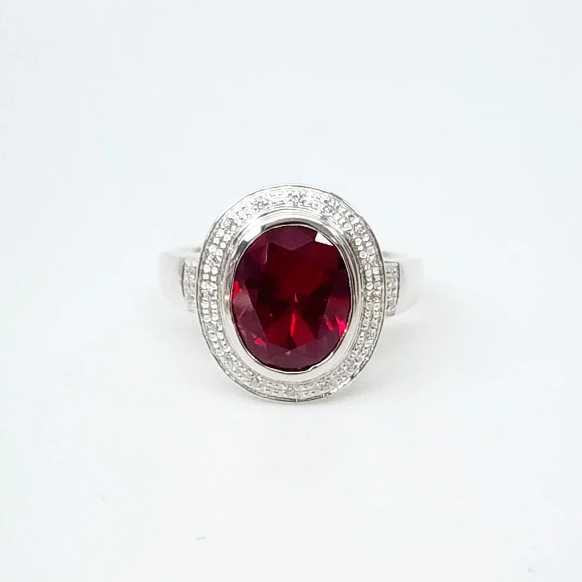 Sterling Silver 10mm x 13mm Ocal Cut Bezel Set Red CZ and Halo CZ Setting Ladies Dress Ring