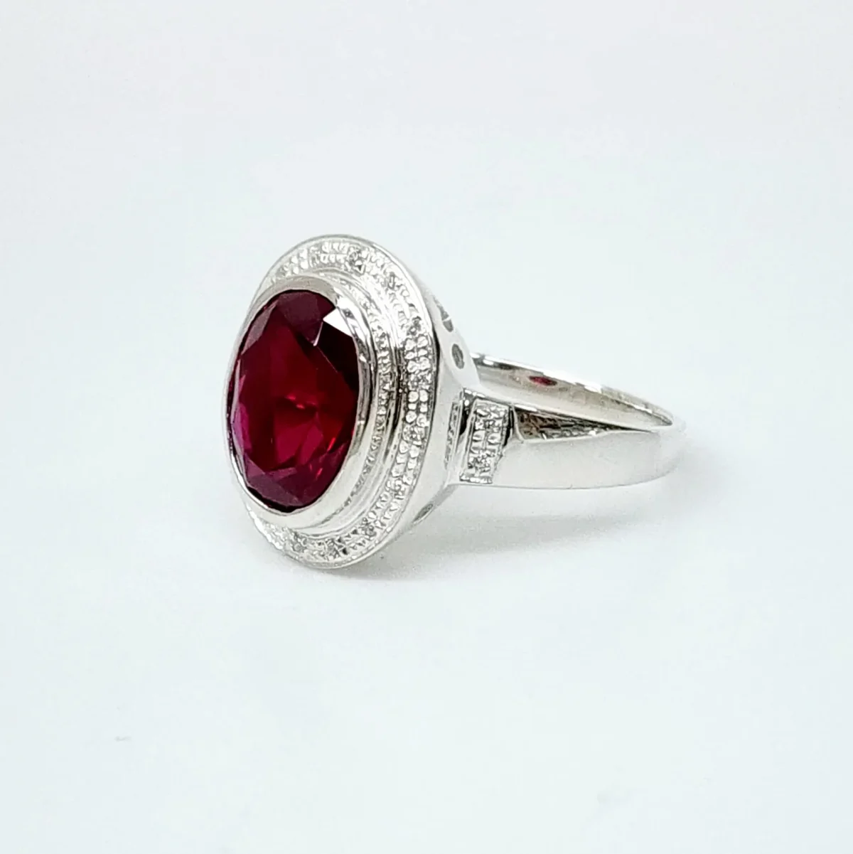 Sterling Silver 10mm x 13mm Ocal Cut Bezel Set Red CZ and Halo CZ Setting Ladies Dress Ring