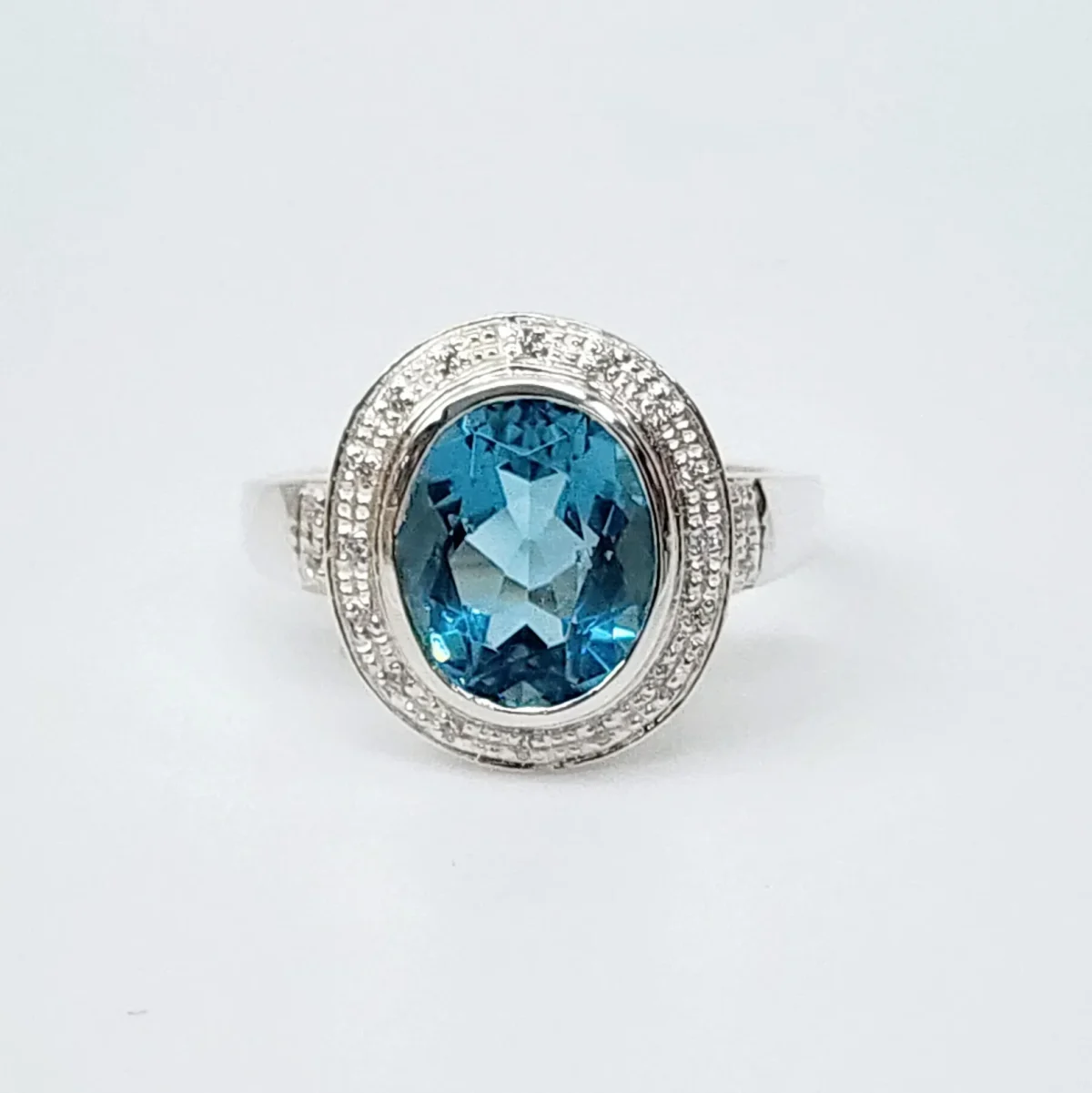 Sterling Silver 10mm x 13mm Ocal Cut Bezel Set Topaz CZ and Halo CZ Setting Ladies Dress Ring