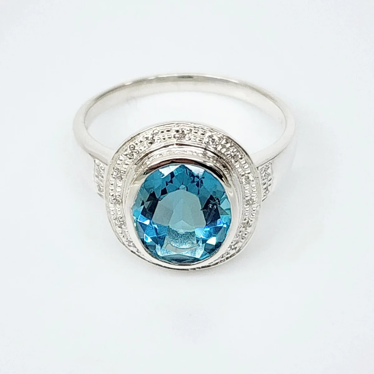 Sterling Silver 10mm x 13mm Ocal Cut Bezel Set Topaz CZ and Halo CZ Setting Ladies Dress Ring