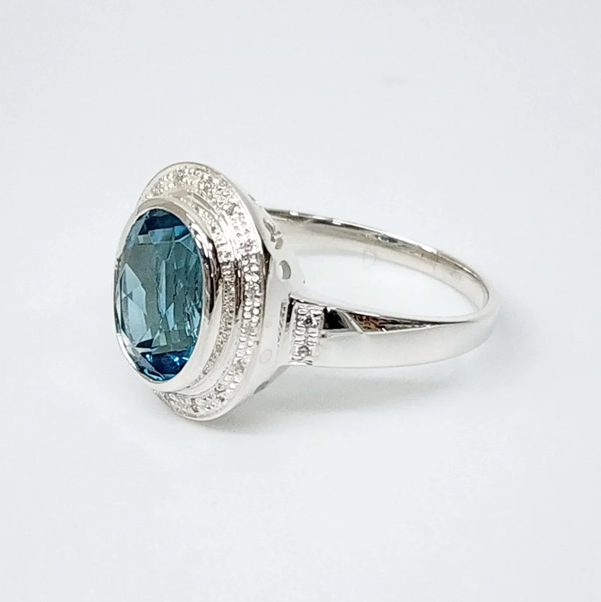 Sterling Silver 10mm x 13mm Ocal Cut Bezel Set Topaz CZ and Halo CZ Setting Ladies Dress Ring