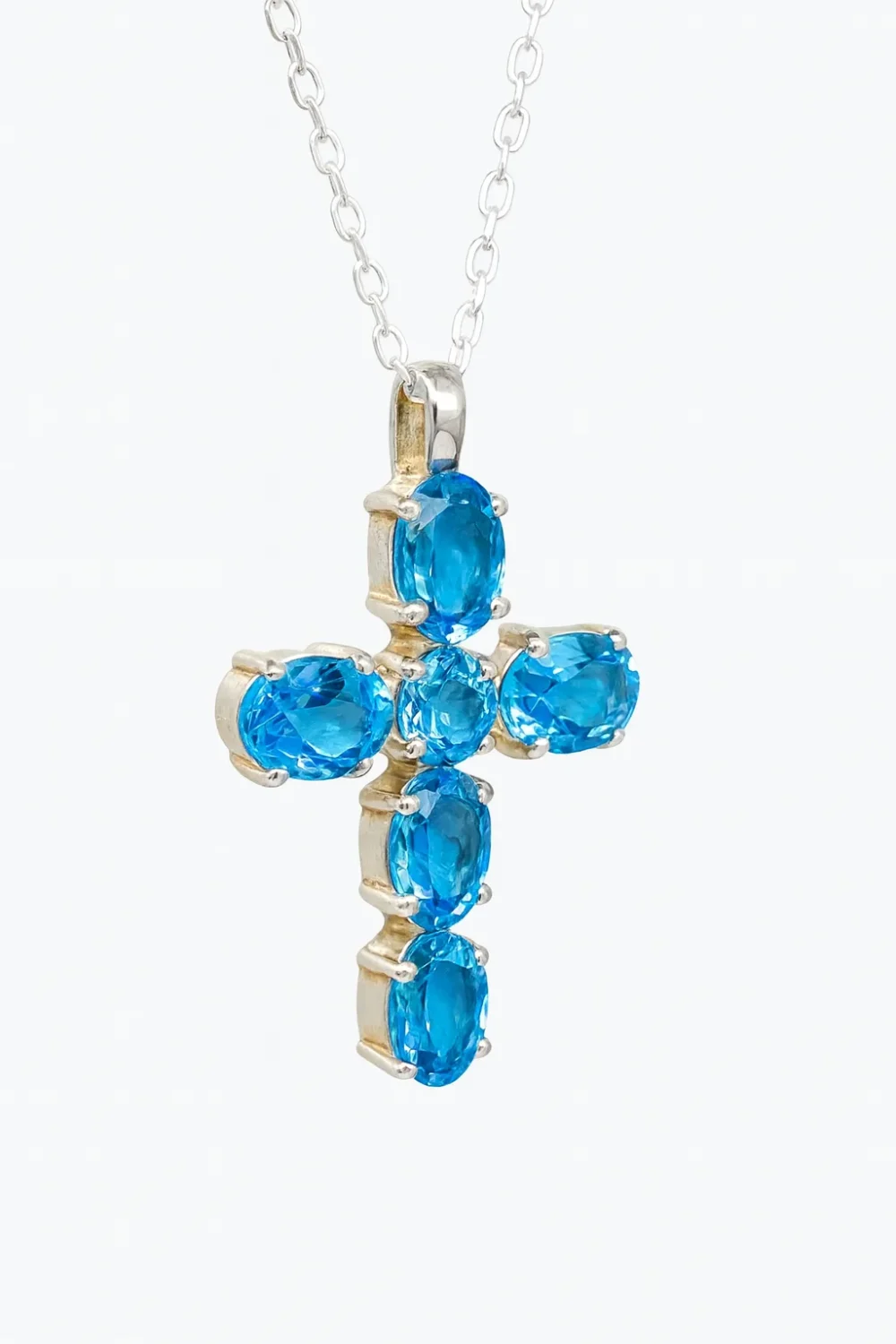 Sterling Silver Cross Pendant with Blue Topaz Setting - SC11