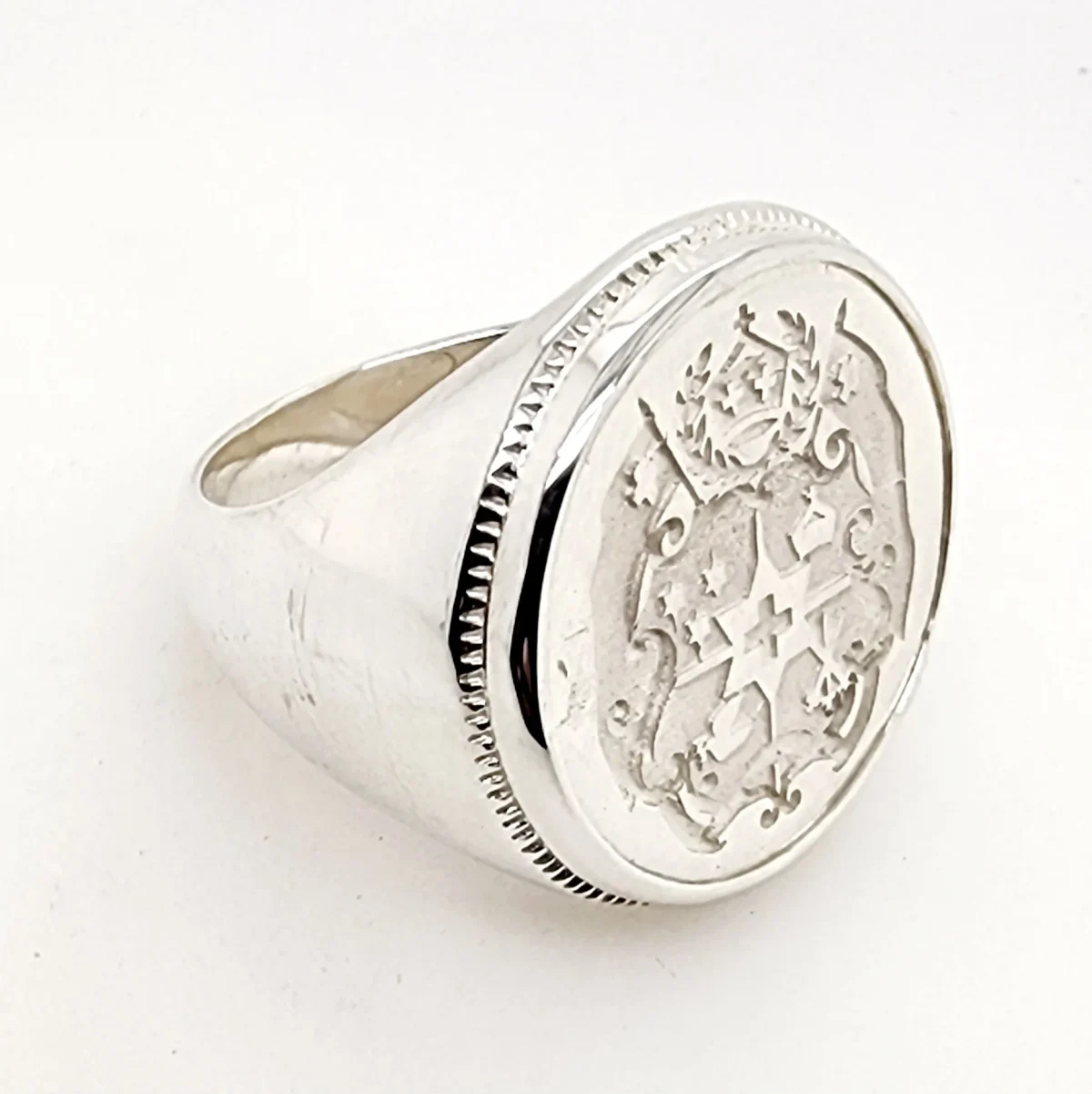 Sterling Silver Tongan Sila Coin Ring with Solid Ring Mount