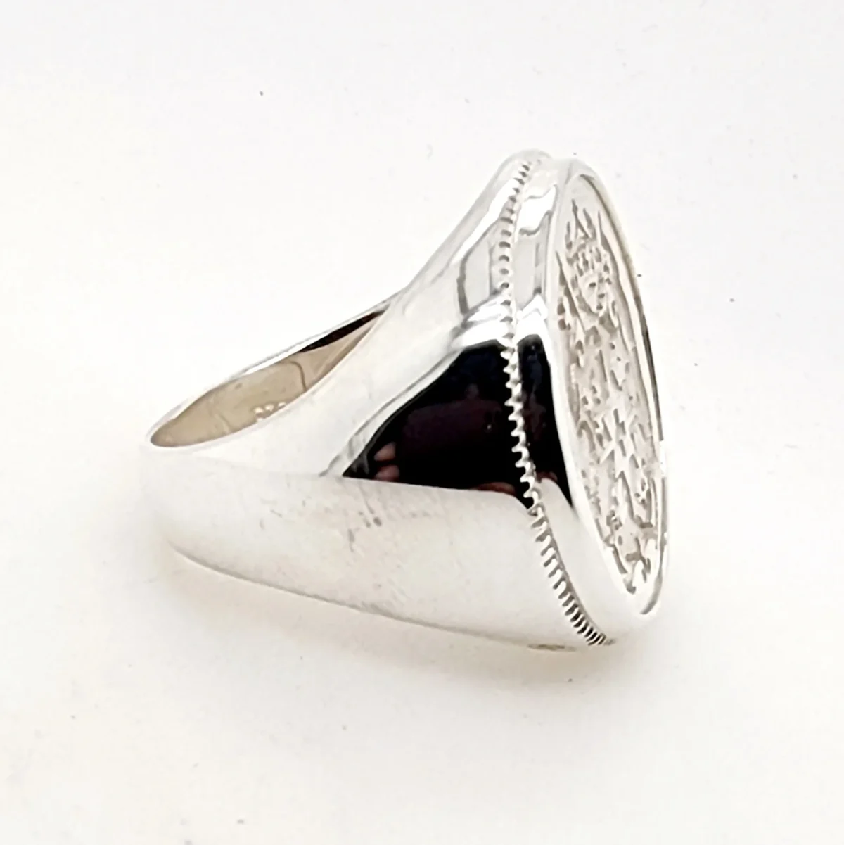 Sterling Silver Tongan Sila Coin Ring with Solid Ring Mount