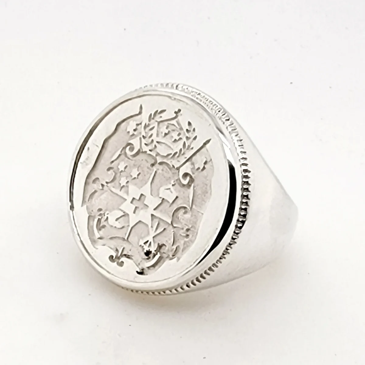Sterling Silver Tongan Sila Coin Ring with Solid Ring Mount