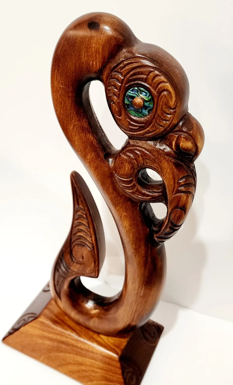 Wooden Carved Maori Fish Hook with Paua Shell Eyes on Stand