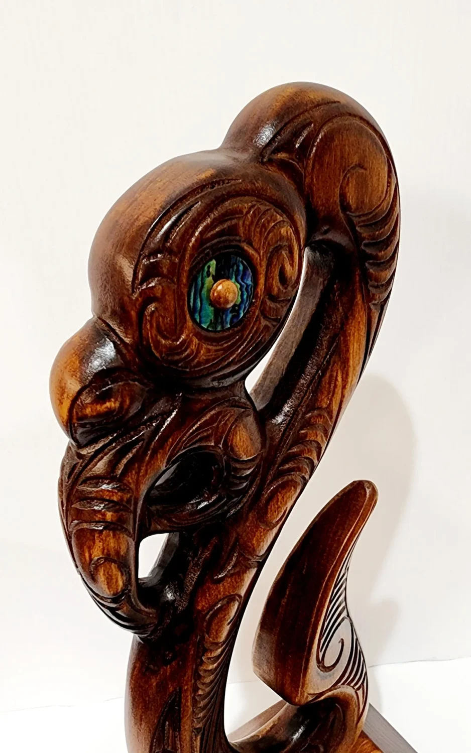 Wooden Carved Maori Fish Hook with Paua Shell Eyes on Stand