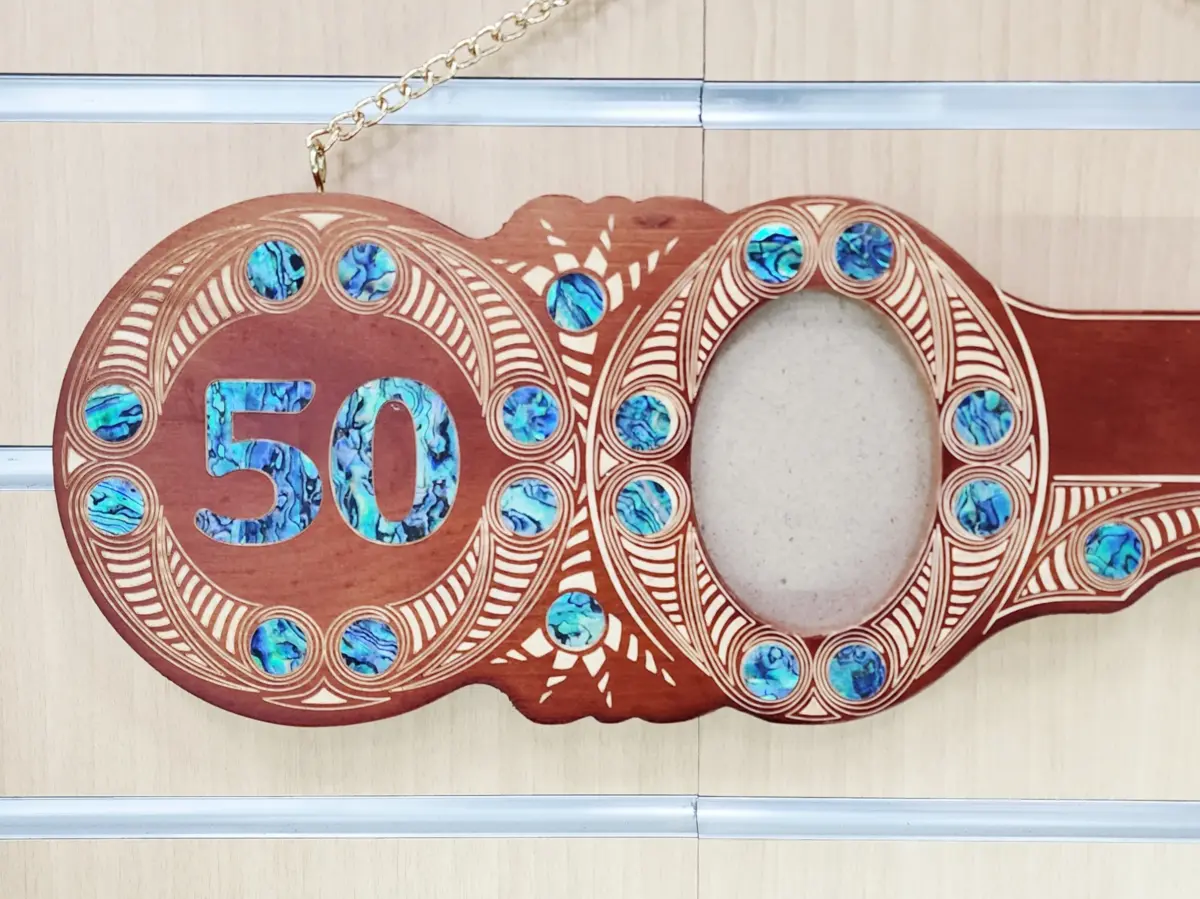50th Birthday Māori Design Wooden Key – Pāua Shell Inlay "50" with 22 Pāua Shell Eyes | Brown Finish - S22DB