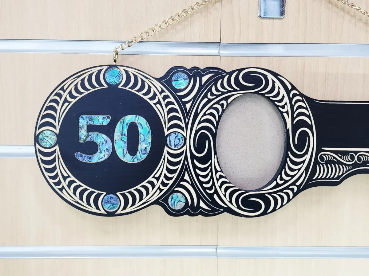 50th Birthday Māori Design Wooden Key – Pāua Shell Inlay "50" with 9 Pāua Shell Eyes - S13BLK