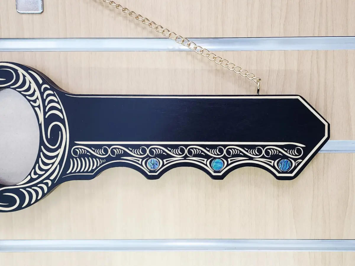 50th Birthday Māori Design Wooden Key – Pāua Shell Inlay "50" with 9 Pāua Shell Eyes - S13BLK