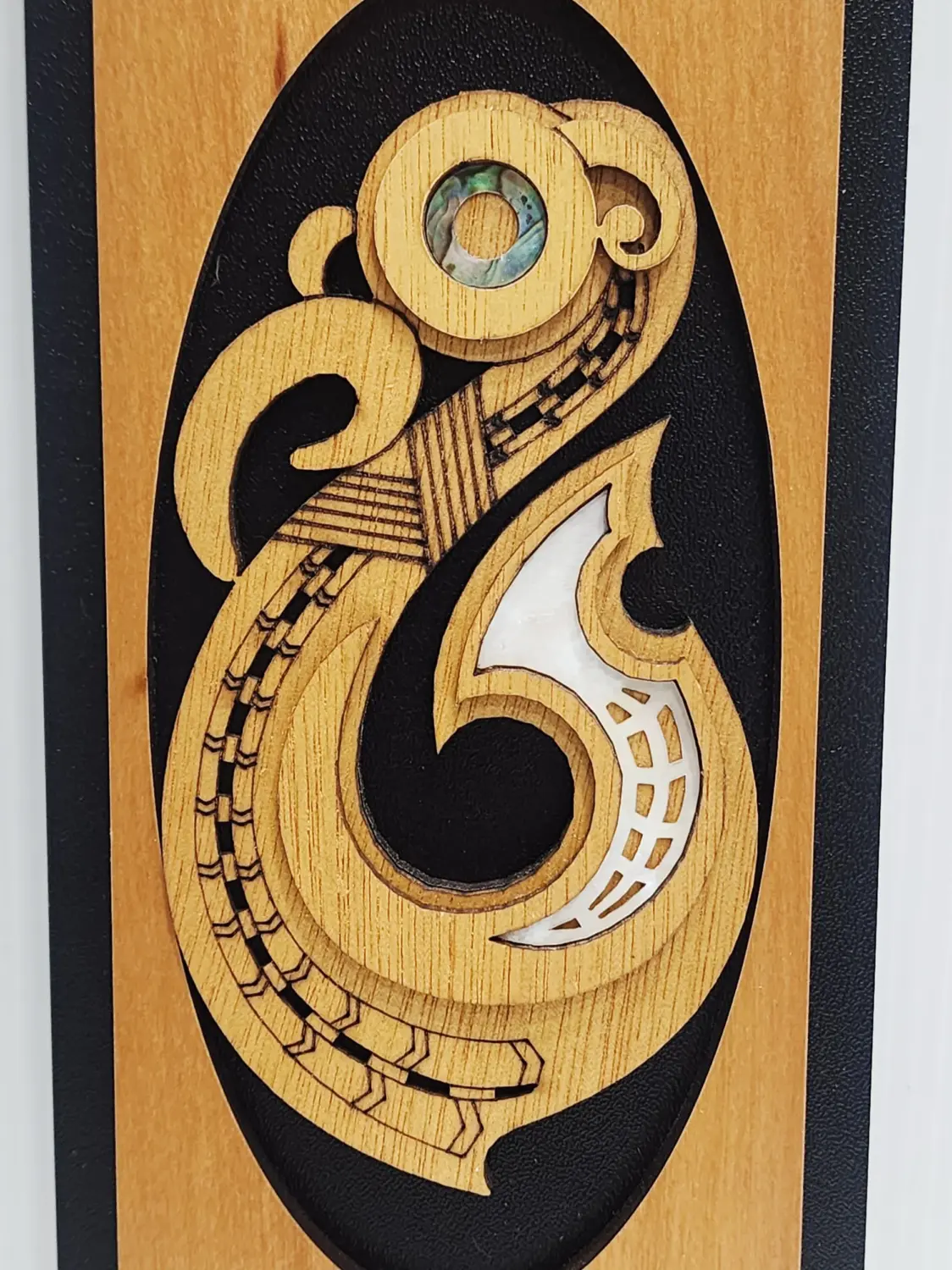 Māori Hei Matau Fish Hook Wooden Wall Art Panel – Rimu Finish with Pāua Shell Detail - WPHK