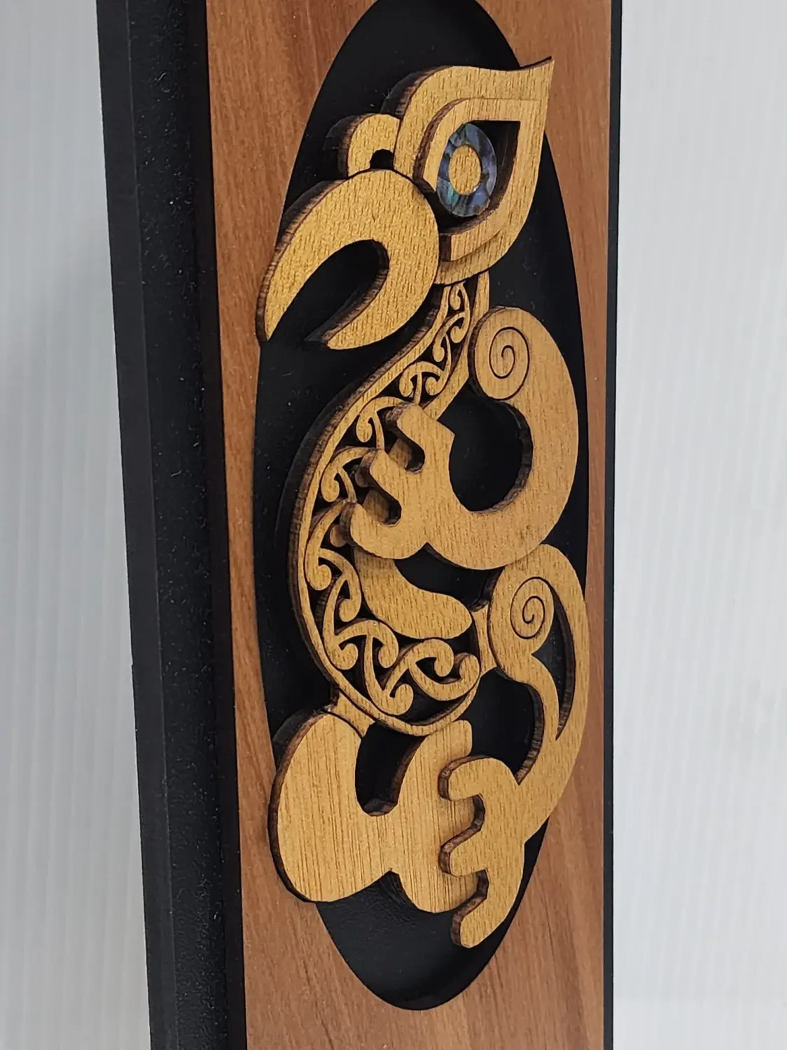 Māori Manaia Guardian Spirit Wooden Wall Art Panel – Rimu Finish with Pāua Shell Detail - WPMA