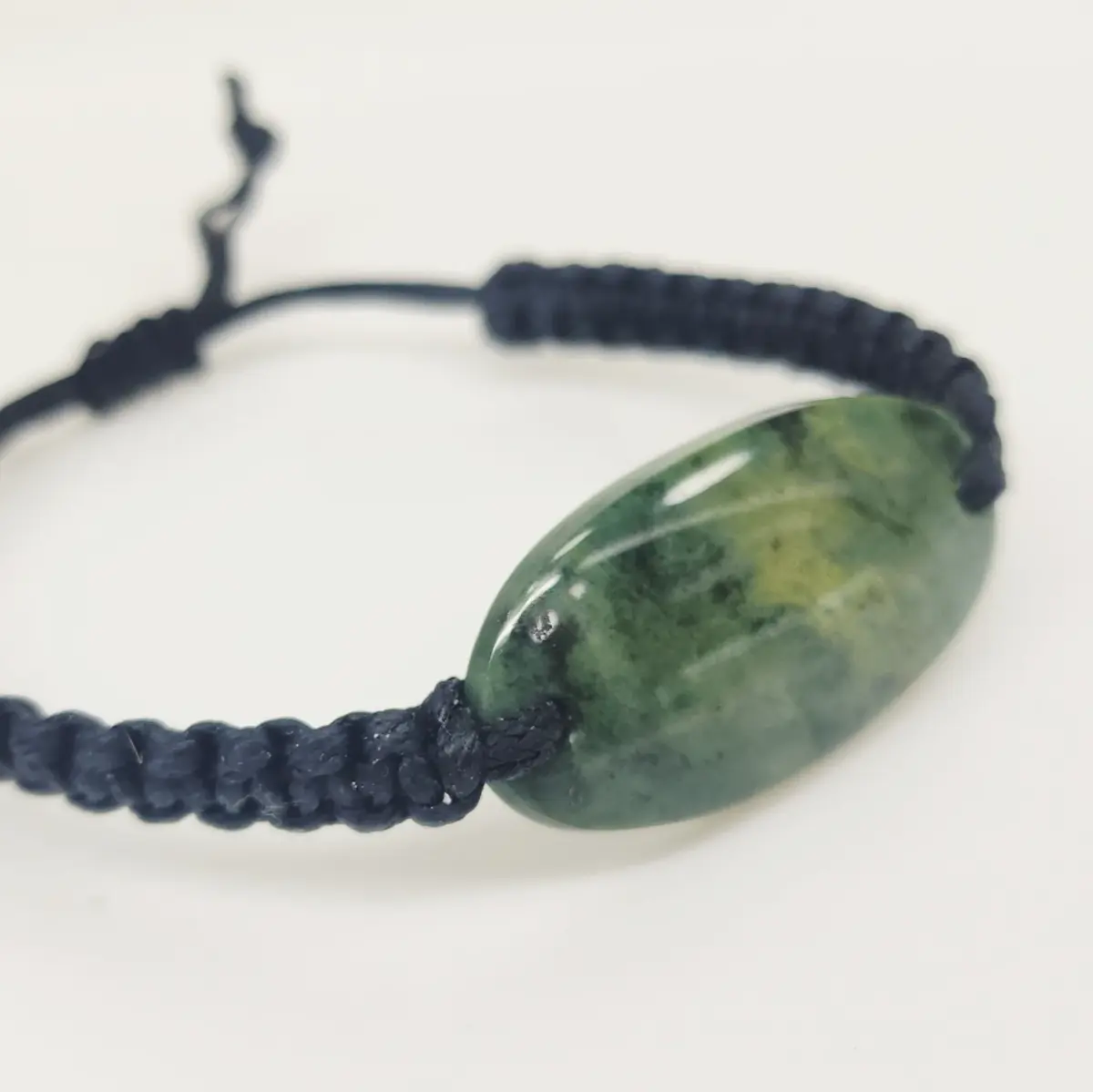 Natural New Zealand Greenstone Oval Polished Disc Bracelet – 45mm x 20mm | Black Braided Adjustable Cord