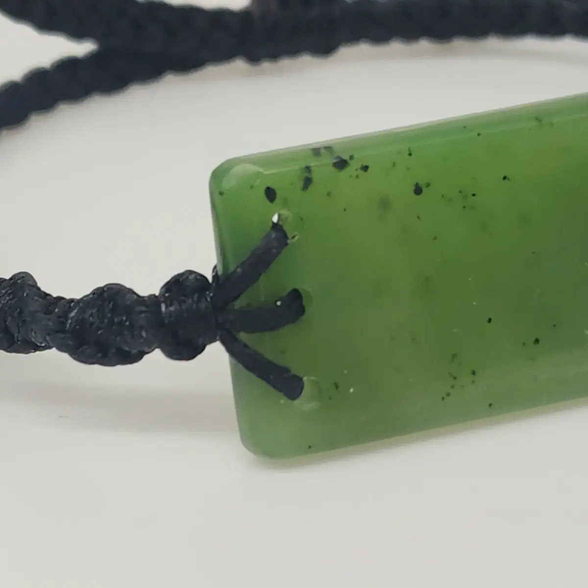 Natural New Zealand Greenstone Rectangular Bracelet – 41mm x 21mm | Black Plaited Adjustable Cord
