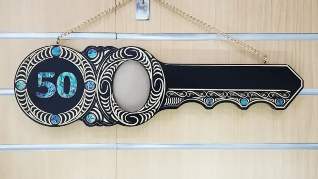 50th Birthday Māori Design Wooden Key – Pāua Shell Inlay "50" with 9 Pāua Shell Eyes - S13BLK